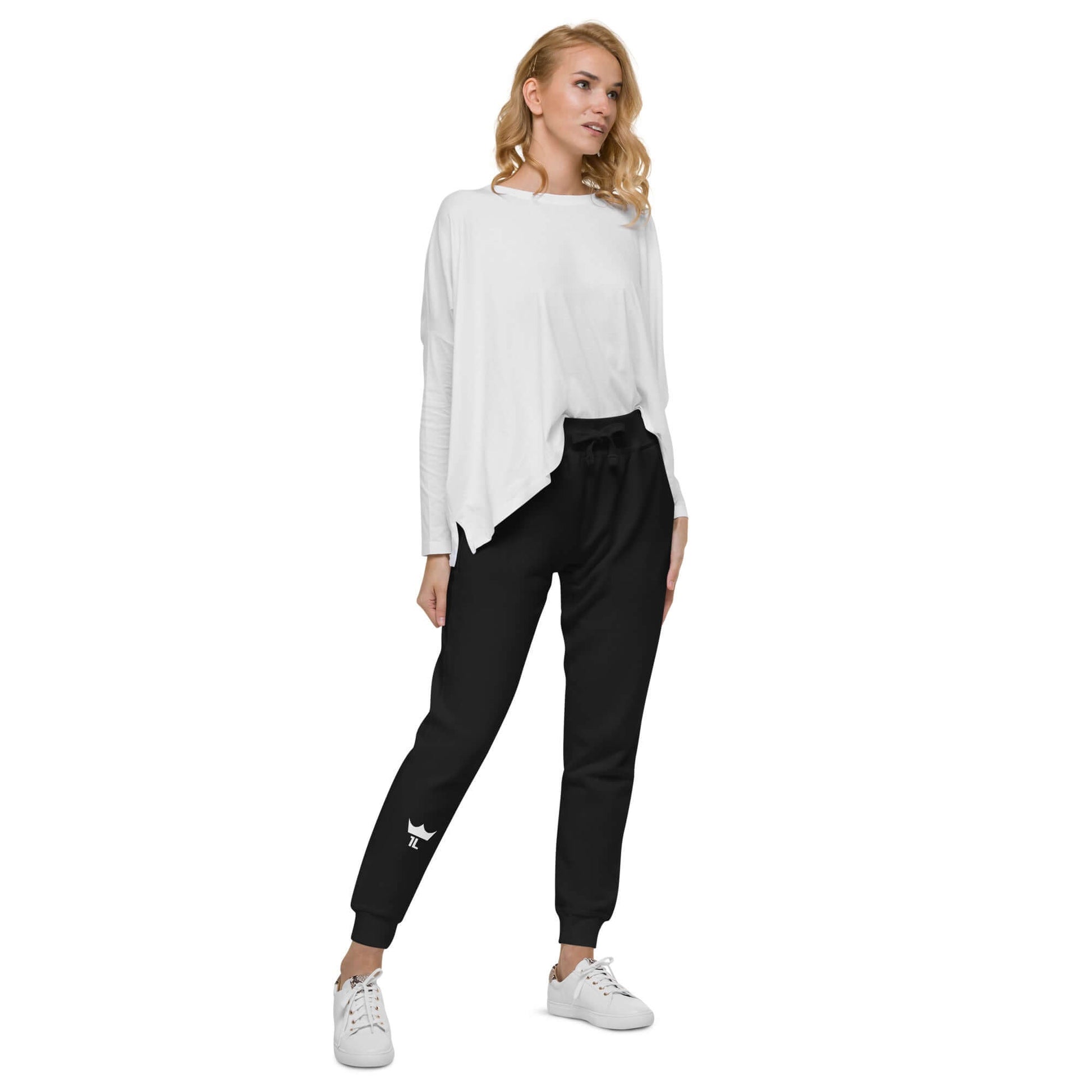 woman wearing black sweatpants with white 1L logo on right shin